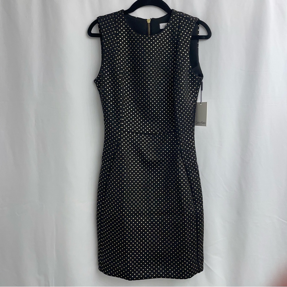 Mini dress Calvin Klein, size 2, black with gold decoration.